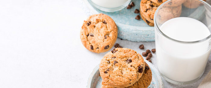 Glass of nice cold milk and a stack of Chocolate Chip cookies